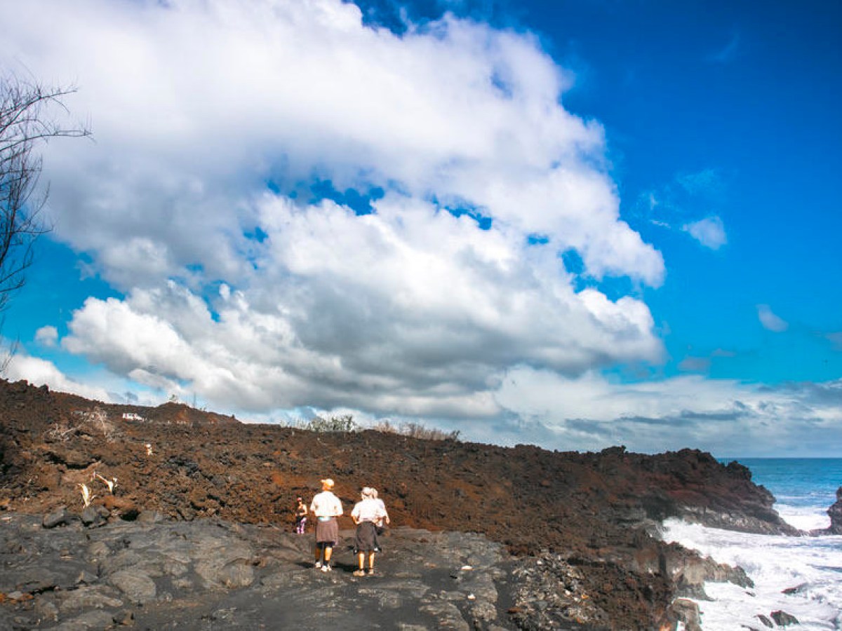 a man riding on top of a mountain
